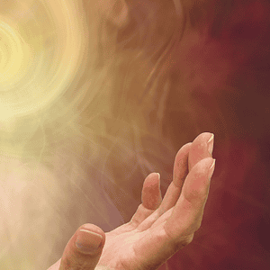 Ihmisen kädet ylläpitämä energiapallo, symboloi parantavaa voimaa ja hyvinvointia.